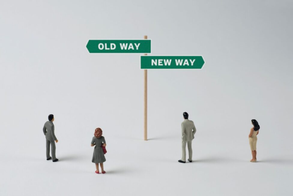 : Person standing at a crossroads or path, representing life transitions and the search for purpose.