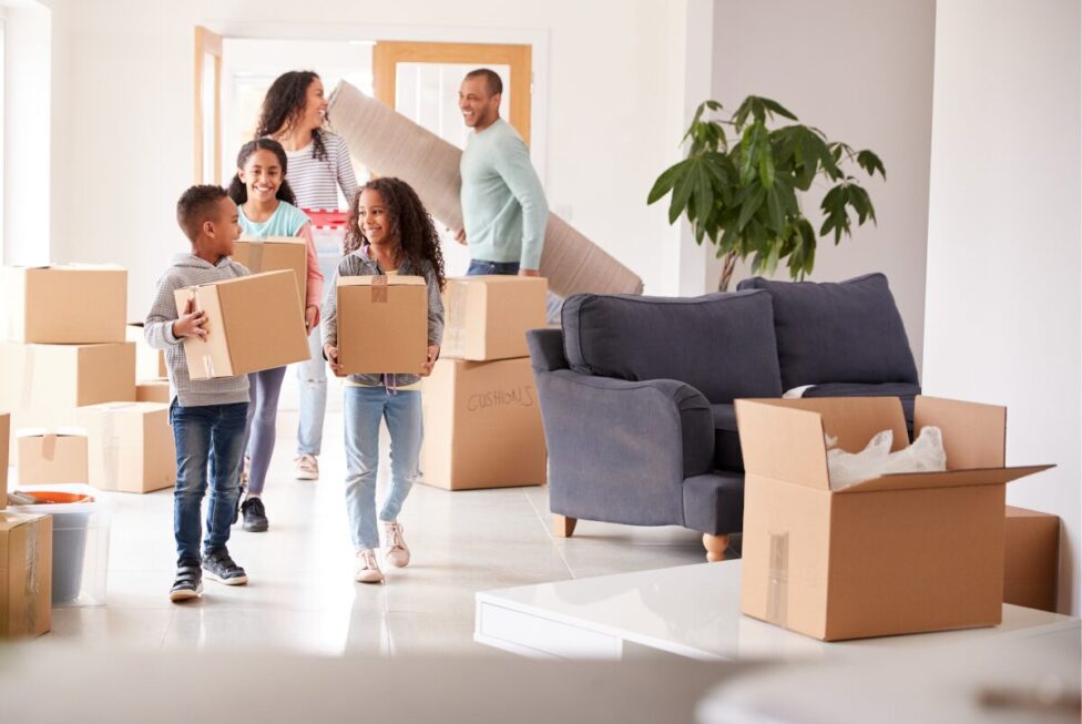 Person packing boxes and preparing for a move, symbolizing career change or relocation and emotional adjustment.
