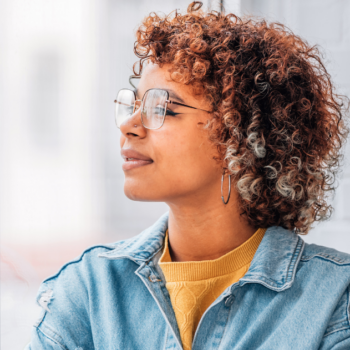 Person calmly in reflection symbolizing faith-based support for anxiety and stress.