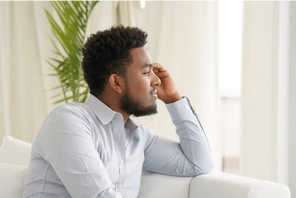 • Person reflecting while processing grief and emotional healing after loss.