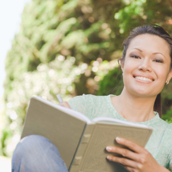 Person reflecting and journaling while exploring meaning and fulfillment in life.