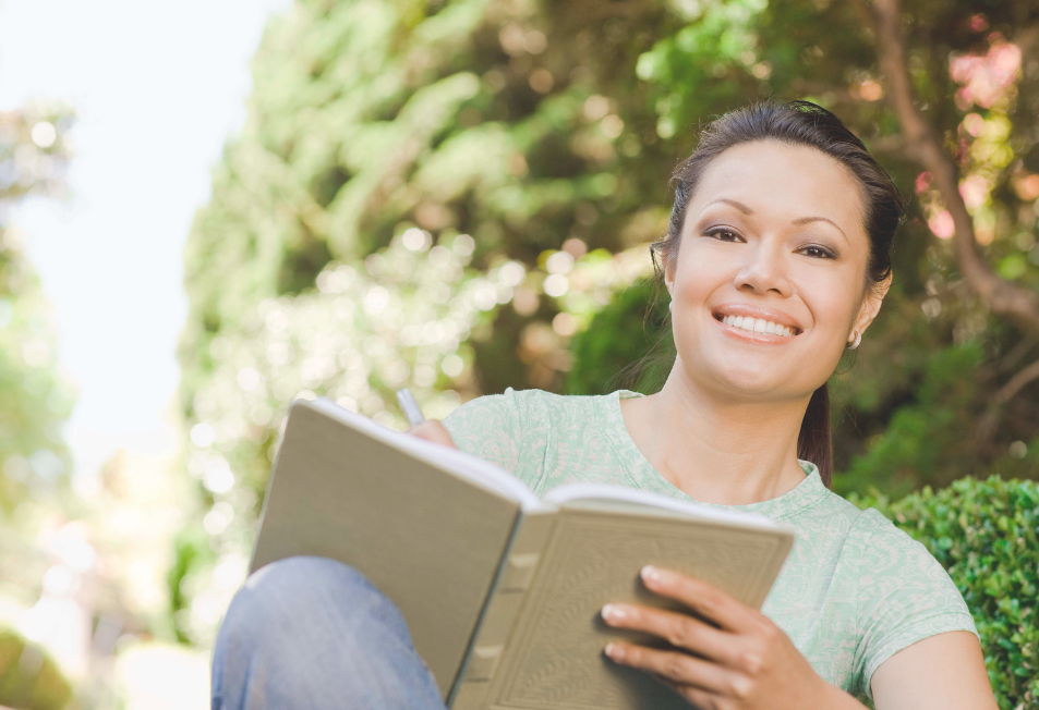 Person reflecting and journaling while exploring meaning and fulfillment in life.
