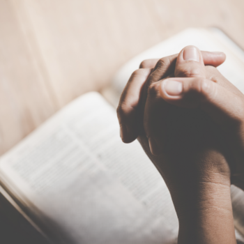 Person reading Scripture and reflecting on emotional resilience and mental health.